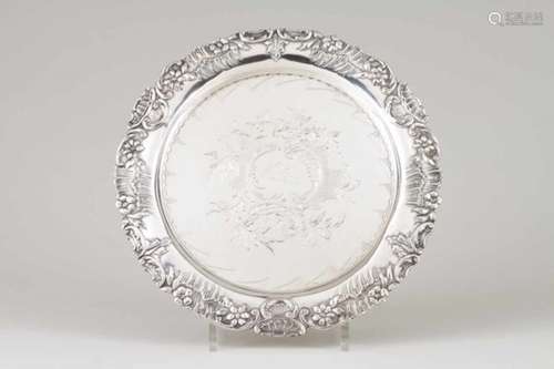 A footed salverPortuguese silverRococo decoration rim and chiselled base with central monogramOn 3