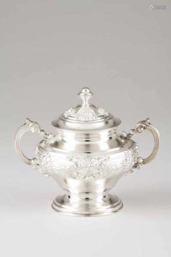 A sugar bowl and coverPortuguese silverRepoussé and chiselled shell and volute decoration, leaf