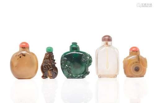 FIVE CARVED MIXED HARDSTONE CHINESE SNUFF BOTTLES