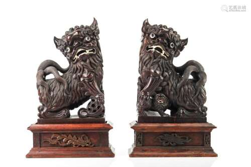 PAIR OF CHINESE HARDWOOD FU LIONS ON STANDS