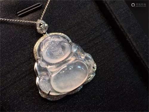 A Chinese Carved Jadeite Buddha Necklace