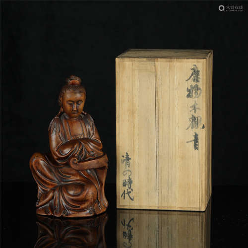 A Chinese Carved Boxwood Figure of Buddha