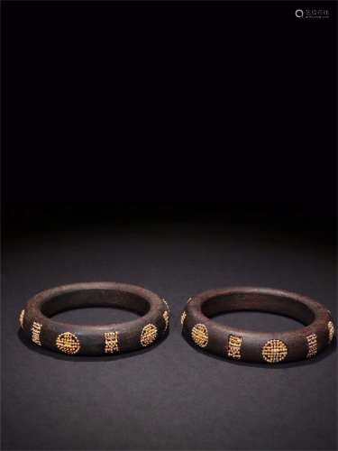 A Pair of Chinese Carved Agar-Wood Bracelets