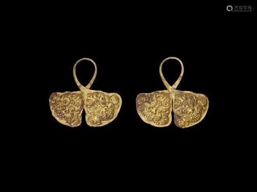 A PAIR OF CHAM REPOUSSÉ GOLD CROWN ORNAMENTS WITH …