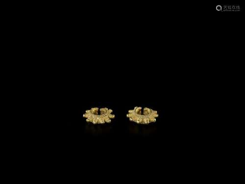 A PAIR OF GOLD EAR ORNAMENTS WITH ELABORATE GOLD T…