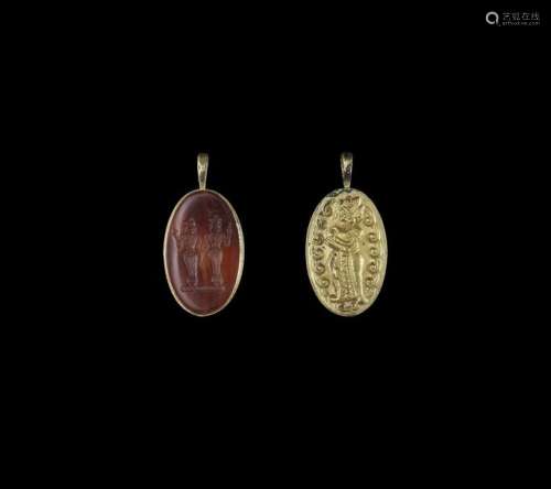 A CHAM REPOUSSÉ GOLD PENDANT WITH STONE INTAGLIO D…