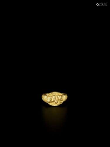 A MASSIVE CHAM RELIEF GOLD RING DEPICTING NANDI