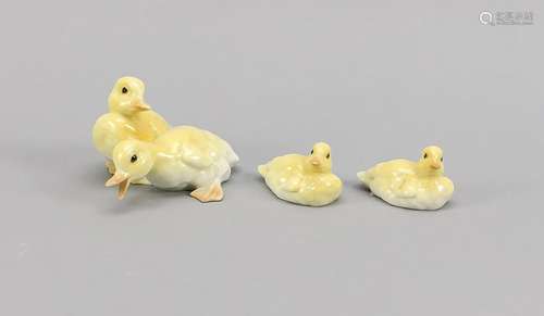 Three duck figures,