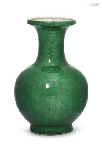 A Chinese monochrome porcelain vase, 18th/19th century, with allover apple-green glaze suffused with