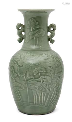 A Chinese porcelain celadon baluster vase, 19th century, with moulded decoration depicting a heron