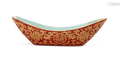 A Chinese porcelain boat-shaped dish, Jiaqing mark and of the period, gilt-painted on a coral ground