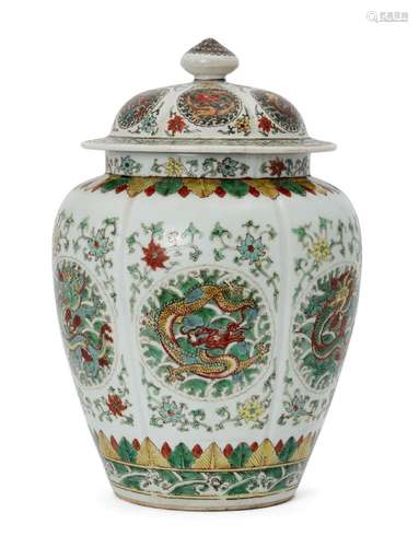 A Chinese porcelain wucai lobed jar, Qing dynasty, painted in enamels to the body with dragon