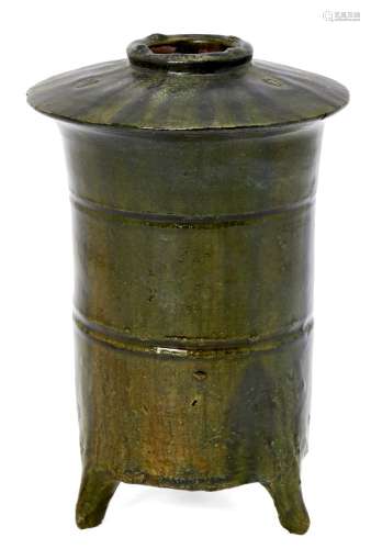 A Chinese terracotta green glazed granary jar, Han dynasty, the cylindrical body incised with two