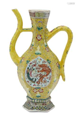 A Chinese porcelain ewer, 19th century, painted in famille rose enamels on yellow ground with a