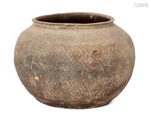 A Chinese grey pottery jar, Warring States period, with broad mouth and slightly everted rim,