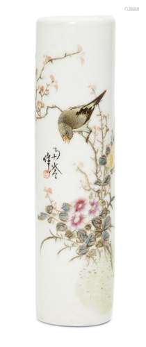 A Chinese porcelain wrist rest, 20th century, painted in famille rose enamels with a bird resting on