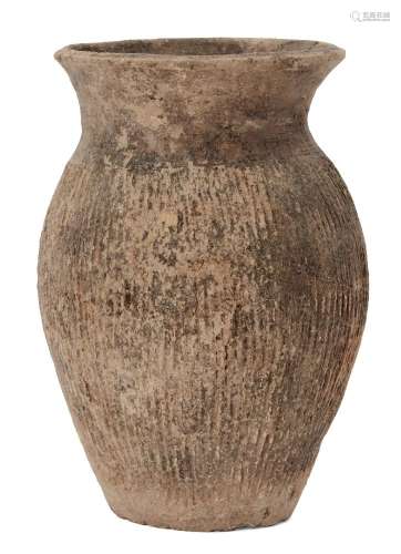 A Chinese grey pottery vase, Warring States, incised with vertical lines to body, 17.5cm high 戰國