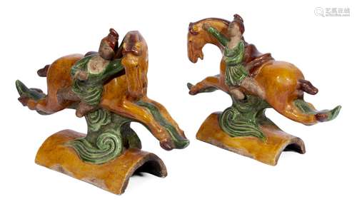 A pair of Chinese Ming-style pottery sancai glazed roof tiles, late Qing dynasty, each depicting a