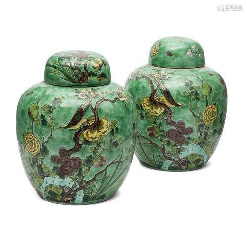 A pair of Chinese porcelain jars and covers, 19th century, painted in famille verte enamels with