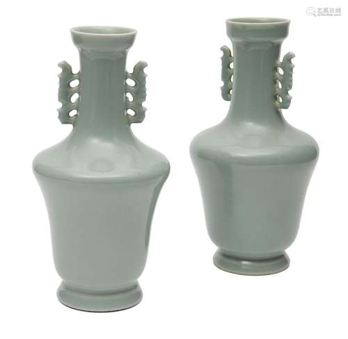 A pair of Chinese porcelain celadon vases, 20th century, with archaistic pierced handles to