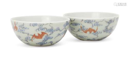 A pair of Chinese porcelain 'bats and clouds' tea bowls, 20th century, each painted with five red