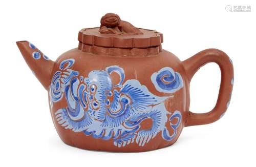 A Chinese yixing melon-shaped teapot, early 20th century, painted in blue enamels with a Buddhist