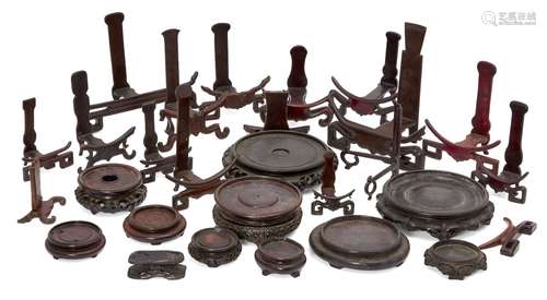 A large Chinese hardwood circular stand, 20th century, 21.5cm diameter, with ten other circular