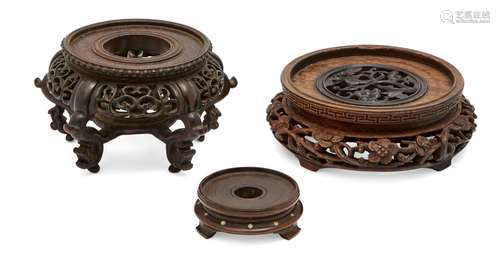 Three Chinese hardwood stands, 20th century, with pierced and carved decoration, largest 12.5cm