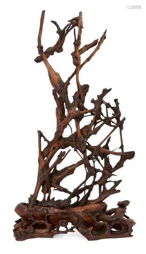 A Chinese abstract rootwood sculpture, late Qing dynasty, carved with branches of blossoming prunus,