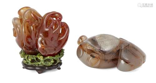 A Chinese agate finger citron carving, 18th century, on carved and stained ivory fitted stand, 8cm