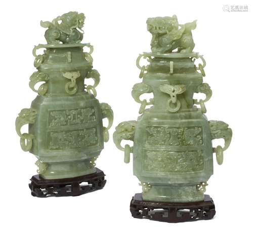 A pair of Chinese green hardstone vases and covers, late 20th century, carved in the archaic style