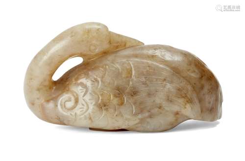 A Chinese celadon jade carving of a crane, 17th century, carved with its head turned towards its