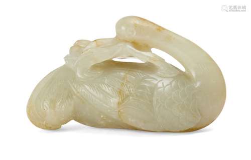 A Chinese celadon jade 'crane and peach' carving, 18th/19th century, carved with neck turned