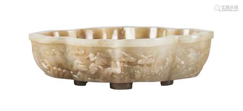 A Chinese jade brushwasher, late Qing dynasty, of quatrilobe form, carved to the sides in low relief