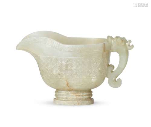 A Chinese pale green jade pouring vessel, yi, 17th century, carved with dragon-head handle and