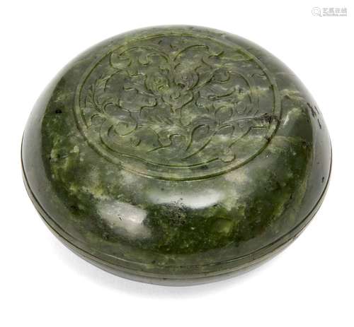 A Chinese spinach jade circular box and cover, 18th/19th century, carved in low relief to the