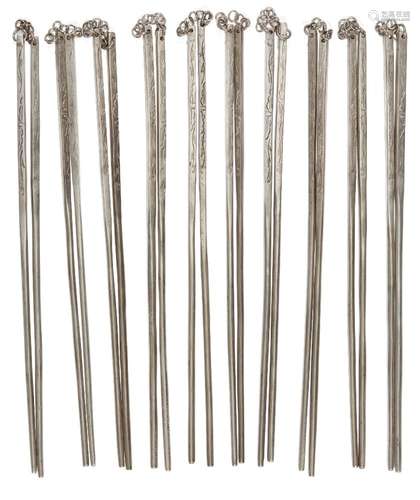 Ten pairs of Chinese white metal chopsticks, late 20th century, each engraved with foliate motifs,