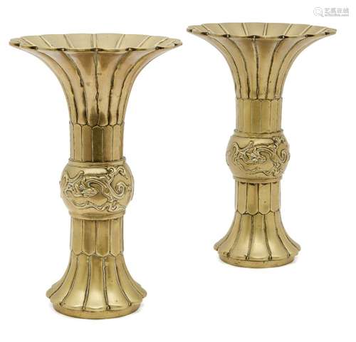 A pair of Chinese polished bronze vases, gu, 19th century, with petal-lobed flared rims, the central