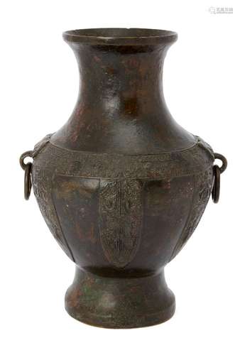 A Chinese Yuan-style bronze archaistic vase, Ming dynasty, with applied taotie mask and loose ring