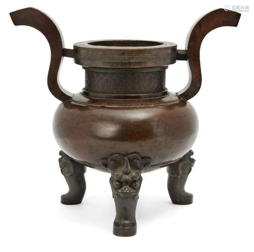 A Chinese bronze archaistic tripod censer, 17th century, with curved upright handles and raised on