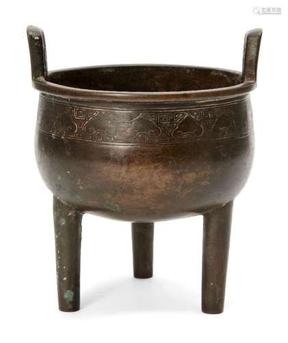 A Chinese bronze tripod censer, ding, 18th/19th century, with band of ruyi head and Greek key