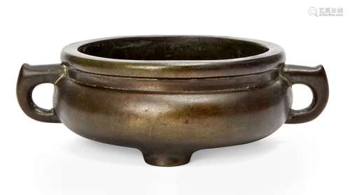 A Chinese bronze tripod censer, late Qing dynasty, of bombe form, with three squat feet,