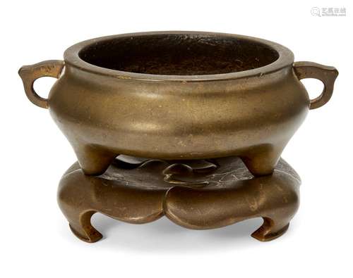 A Chinese polished bronze censer and stand, 18th/19th century, oy typical squat form, with