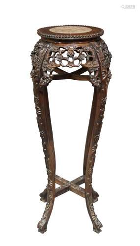 A Chinese hardwood jardinière stand, late 19th century, the rouge marble inset top above carved