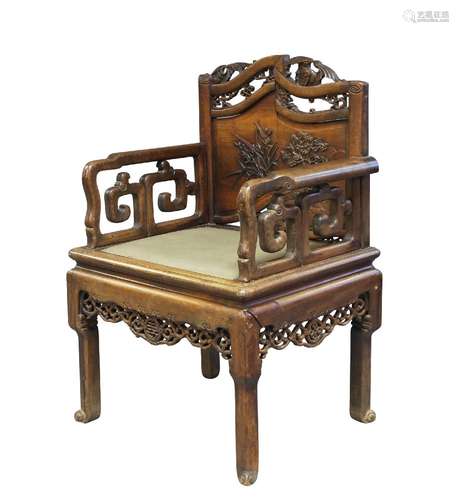 A Chinese hongmu armchair, late 19th century, the pediment carved with two bats above two floral