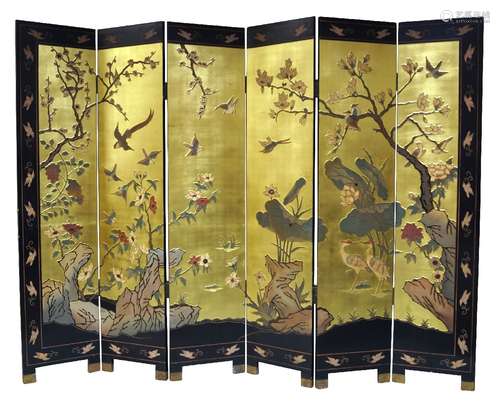 A Chinese lacquered five-fold six panel screen, late 20th century, carved in relief to one side with