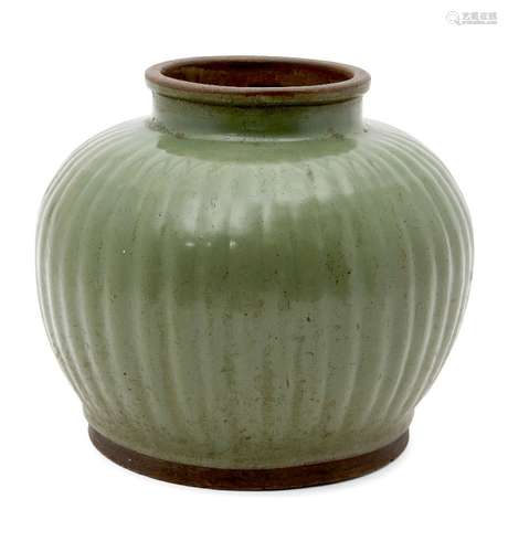 A large Korean pottery celadon glazed jar, 18th/19th century, with wide mouth and lobed body, flat