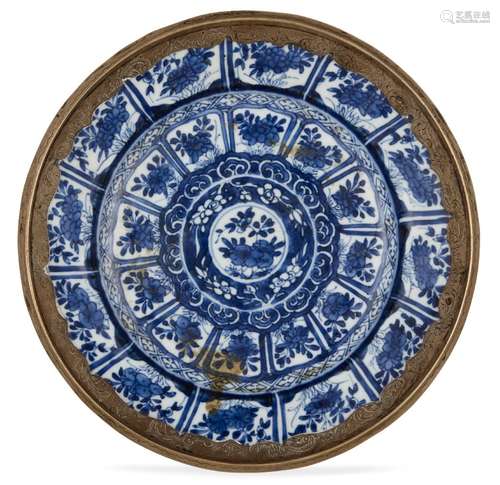 A Chinese porcelain dish, Kangxi period, painted in underglaze blue with rows of lappets decorated