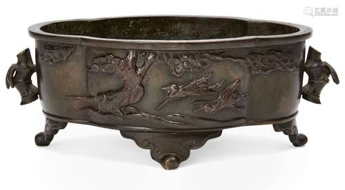 A Japanese bronze quatrilobe censer, 20th century, decorated with cranes flying beneath a pine tree,