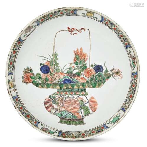 A large Chinese porcelain dish, Kangxi period, painted in famille verte enamels with a basket of